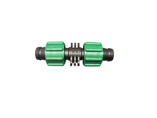 Green and black Irritec Perma-Loc Tape Coupling for 5/8 inch drip tape used in drip irrigation