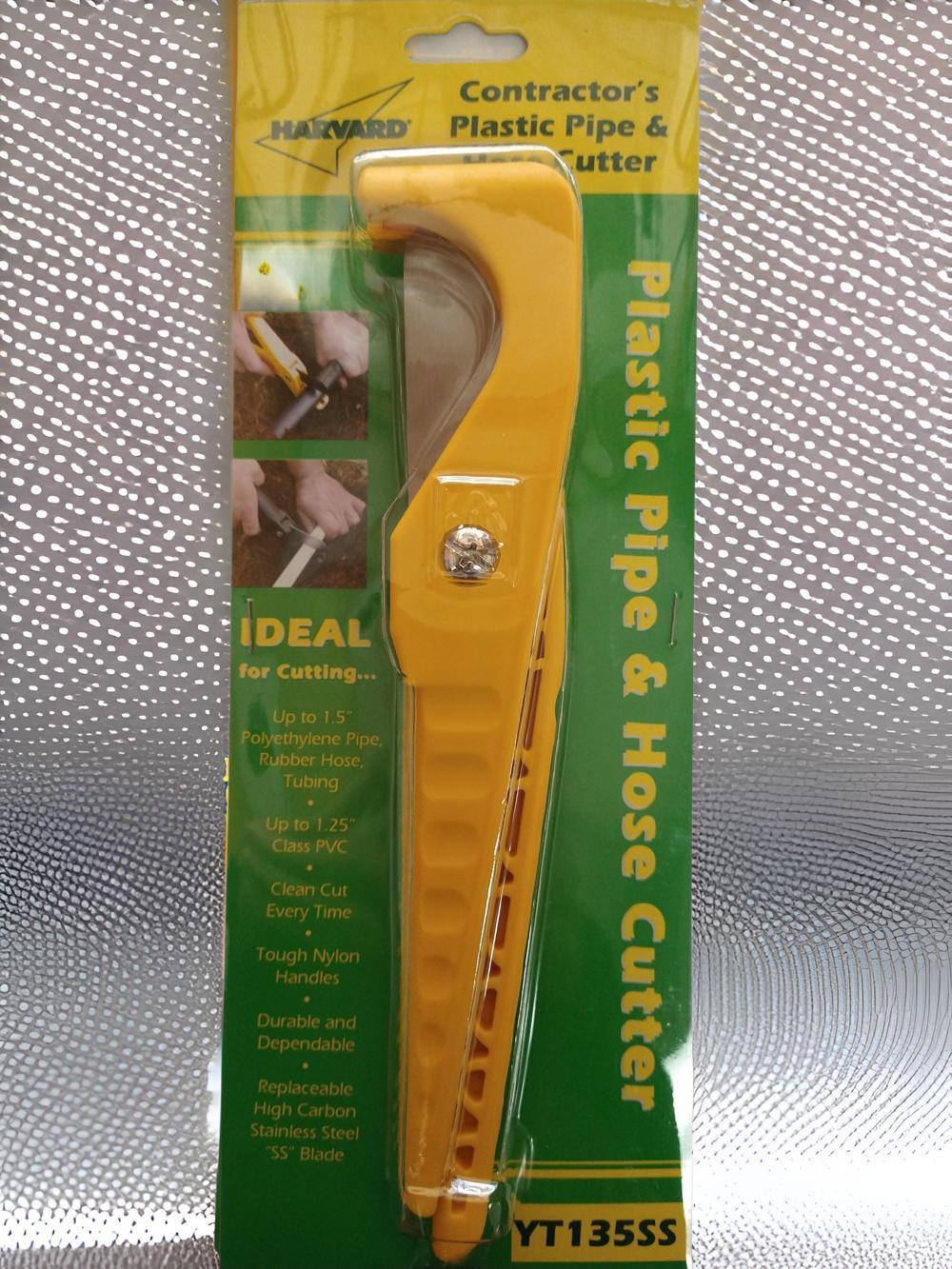 a yellow plastic pipe cutter in a package