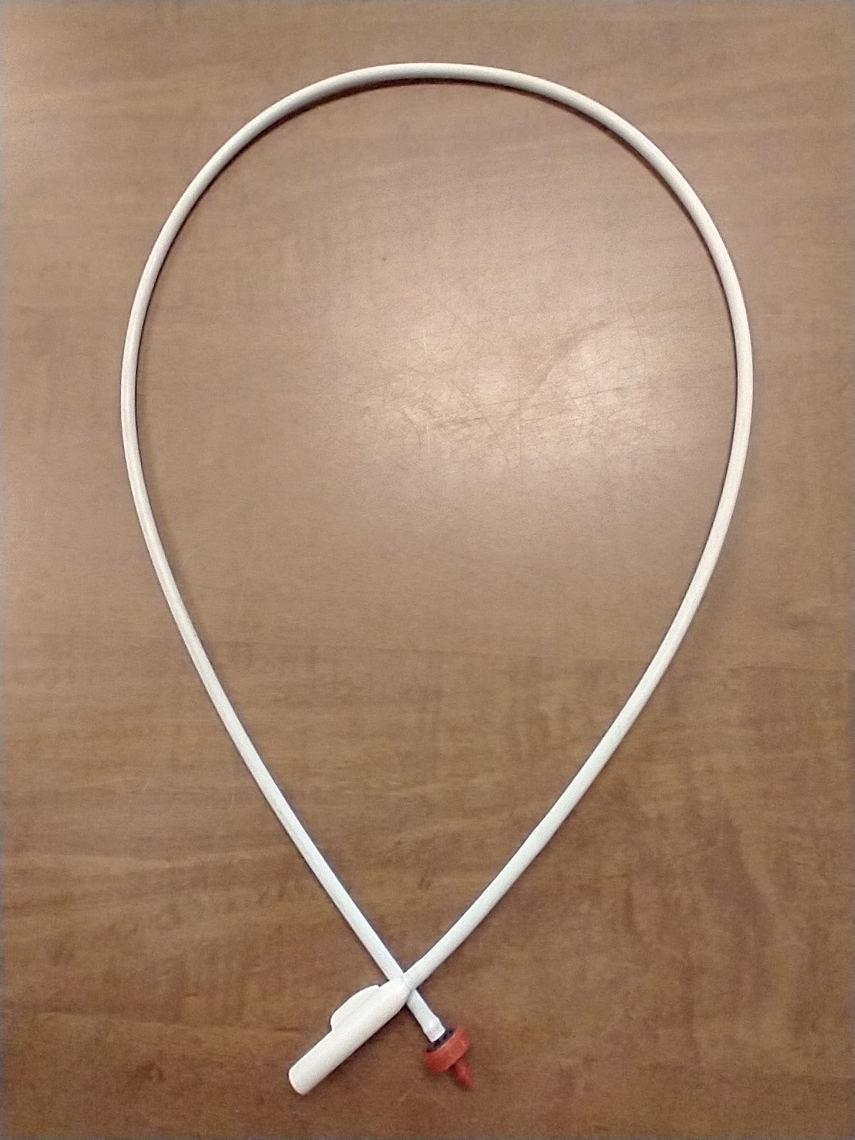 a white cord connected to a white cord