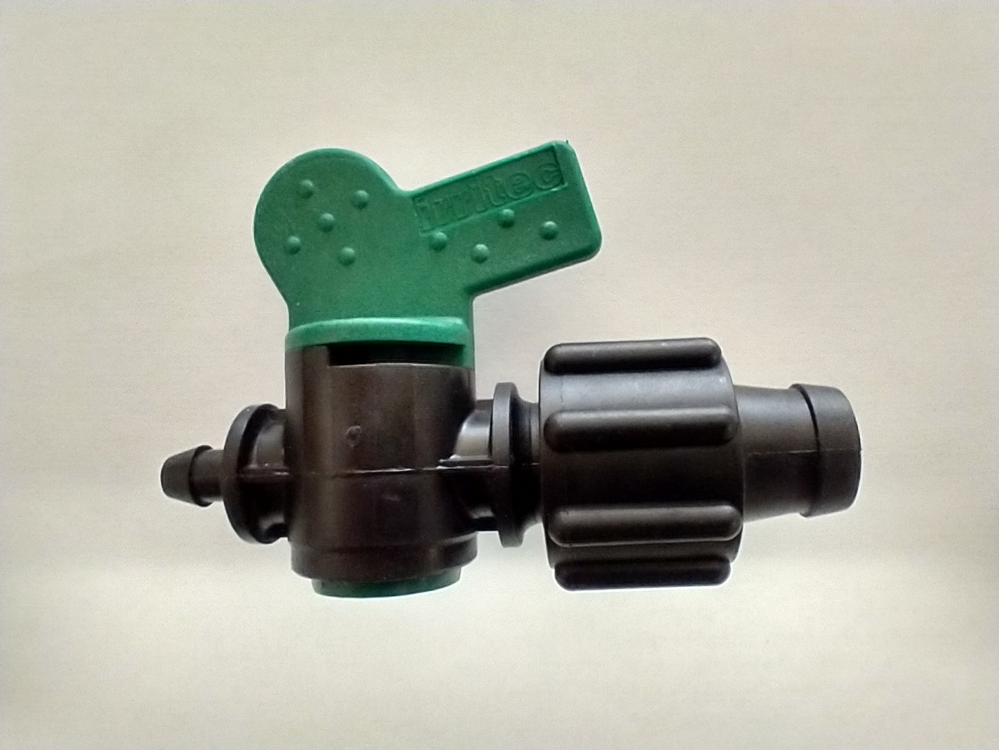 a green and black valve on a white background